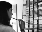 Alisa Belzer at the Scheduling Board. Photo by Clemens Kalischer.