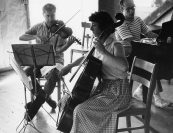 "We (Arnold Steinhardt, Jaime Laredo, Michael Tree, Caroline Levine, Jules Eskin, and Madeline Foley) were having a great time (rehearsing  Dvořák's String Sextet in A Major, Op. 48, B. 80). And Michael always tried to provoke Madeline. She had the most exquisite taste in music. Vulgarity to her was a cardinal sin. And Michael made this unbelievable vulgar slide on purpose. And while he was doing it, he was looking at her. I remember Madeline stopped, well, we all stopped, and she said: “Tree, you have NO taste!”. What I’ll never forget is Jules laughing so hard that he literally fell off his chair. And that was the end of the rehearsal." —Jaime Laredo<br><i>Michael Tree, Madeline Foley, and Jacob Lateiner. Photo by Judson Hall, 1959.

